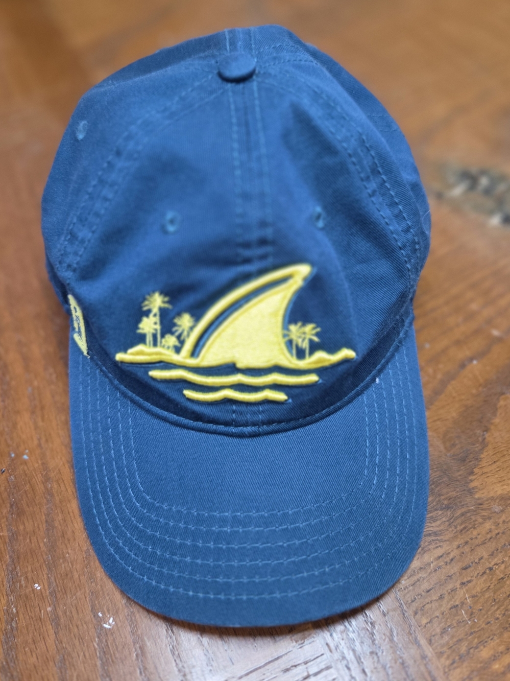 Embroidered Blue Baseball Cap with Yellow Shark Fin Motif